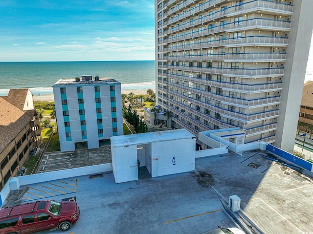 exterior space with a beach view and a water view