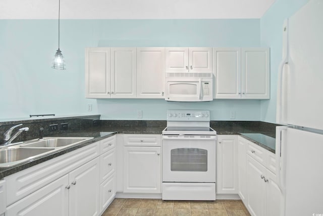 kitchen featuring white cabinets, hanging light fixtures, sink, and white appliances