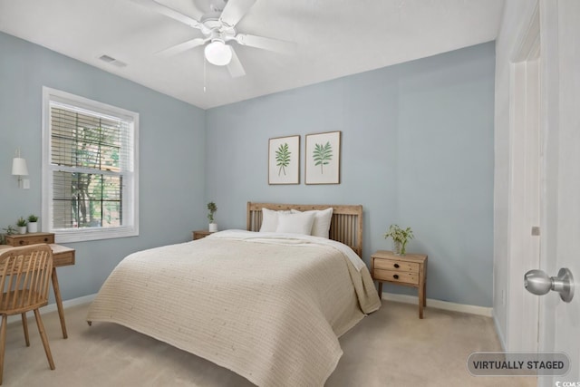 bedroom with light colored carpet and ceiling fan