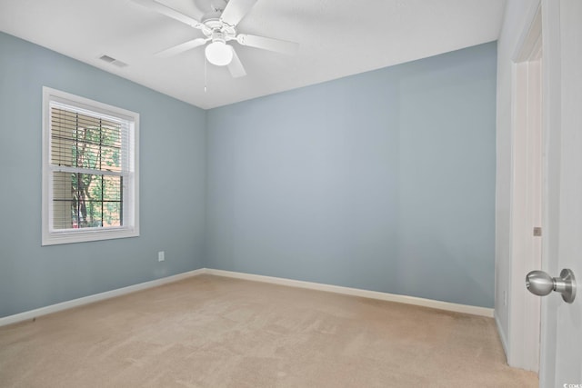 carpeted empty room with ceiling fan