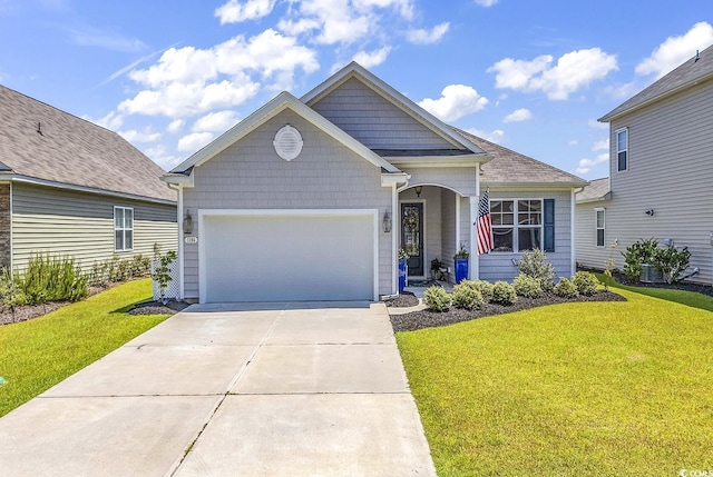 view of front facade with a garage and a front lawn