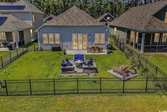 back of property featuring a patio, a sunroom, and a yard