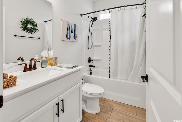 full bathroom with vanity, toilet, and shower / bath combo with shower curtain