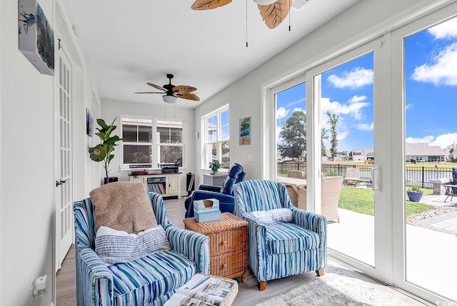 sunroom / solarium with ceiling fan