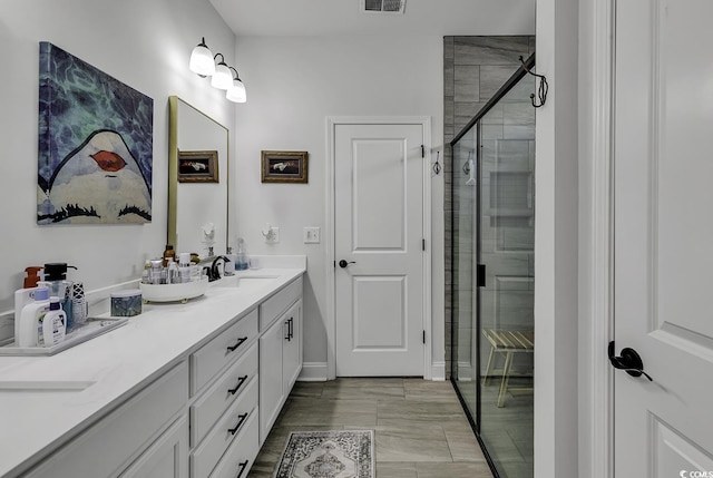 bathroom with vanity and an enclosed shower