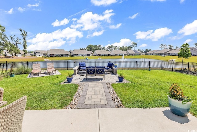 view of yard featuring a water view and a patio area