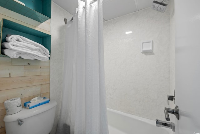 bathroom with shower / bath combination with curtain and toilet