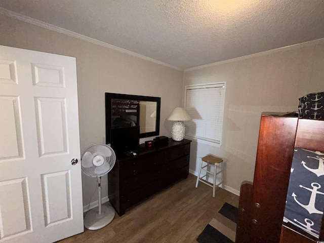 bedroom with crown molding, dark wood-type flooring, and a textured ceiling