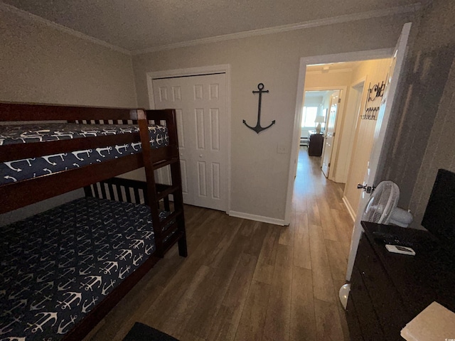 bedroom with ornamental molding and hardwood / wood-style floors