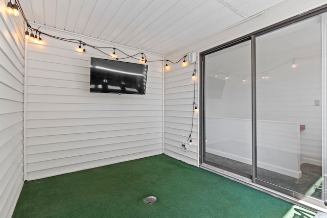 unfurnished sunroom featuring wooden ceiling