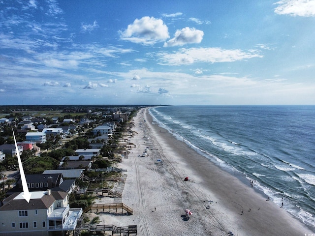 drone / aerial view with a beach view and a water view