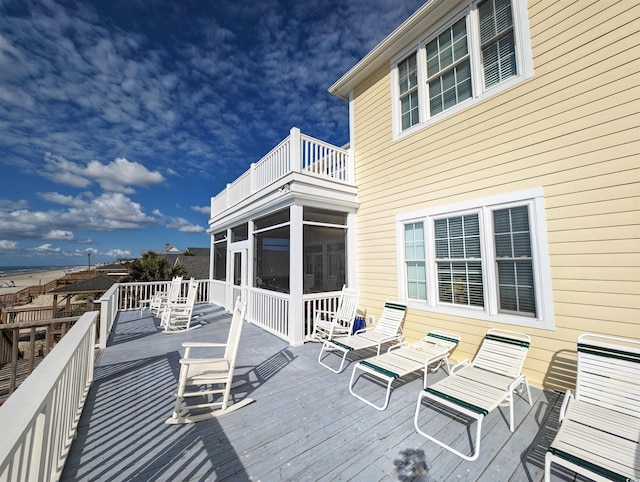 deck with a sunroom