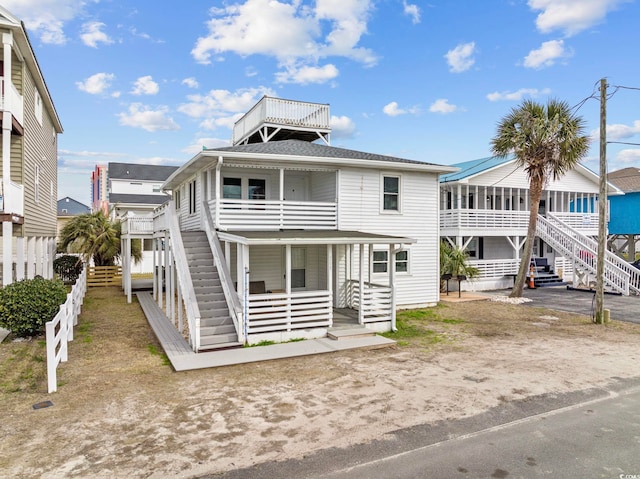 back of house with a balcony