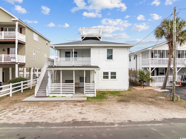 view of front of property with a balcony