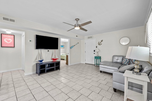 living room with ceiling fan and light tile patterned floors