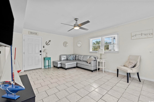 tiled living room with ceiling fan