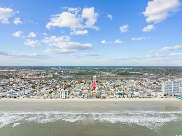 birds eye view of property with a beach view and a water view