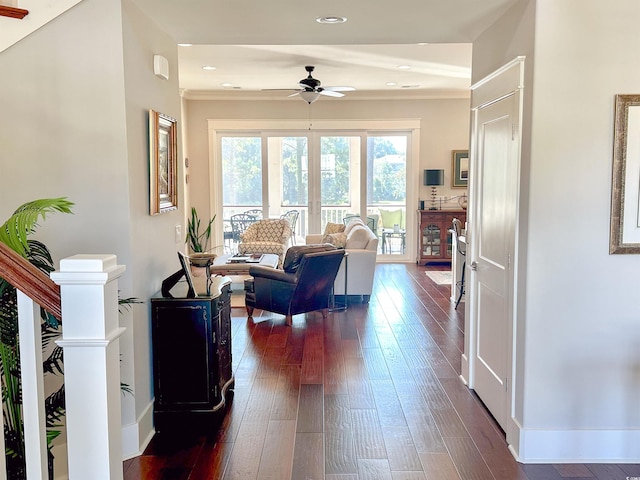 living room featuring ornamental molding and dark hardwood / wood-style floors