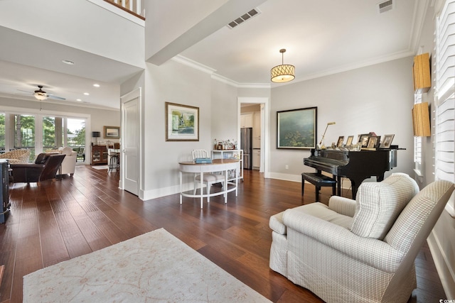 living room featuring crown molding, ceiling fan, and dark hardwood / wood-style flooring