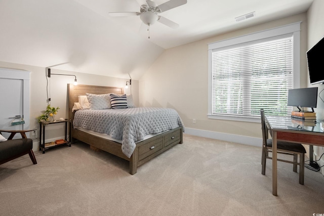 carpeted bedroom featuring vaulted ceiling and ceiling fan