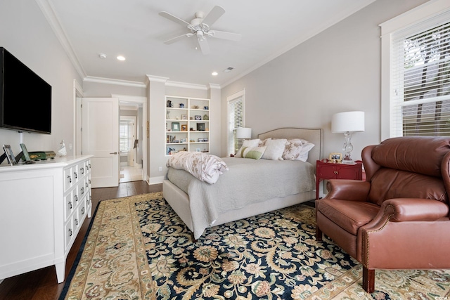 carpeted living room with crown molding and ceiling fan