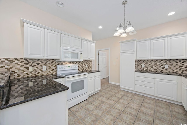 kitchen featuring decorative backsplash, white appliances, white cabinets, and hanging light fixtures