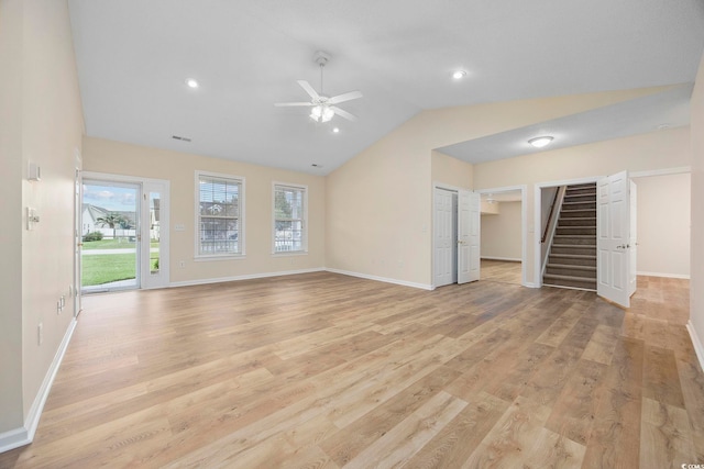 unfurnished living room featuring lofted ceiling, ceiling fan, and light wood-type flooring