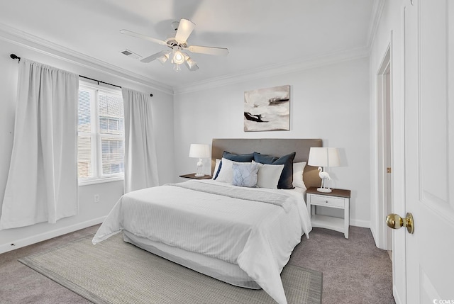 carpeted bedroom featuring ceiling fan and ornamental molding