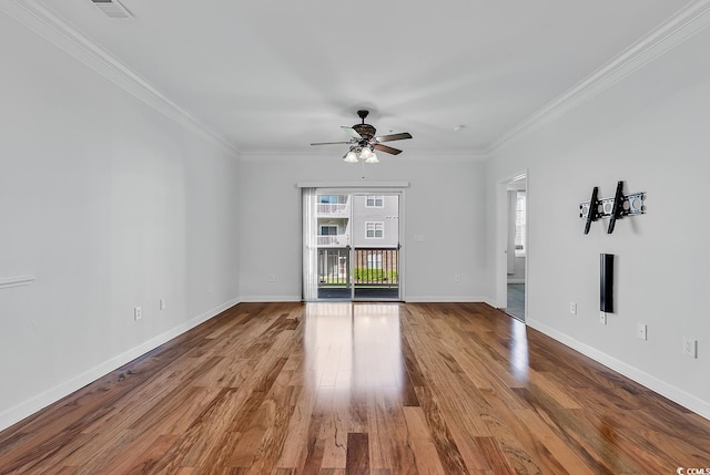 spare room with light wood-type flooring, crown molding, and ceiling fan