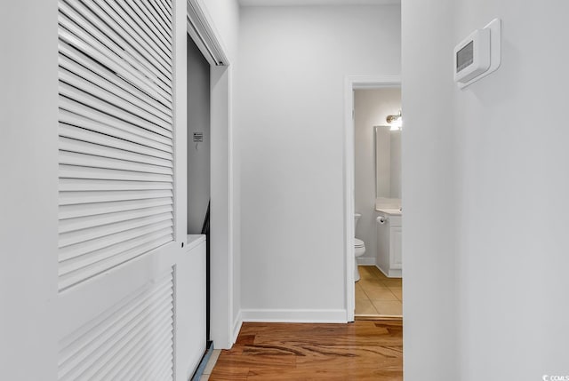 hallway with light wood-type flooring