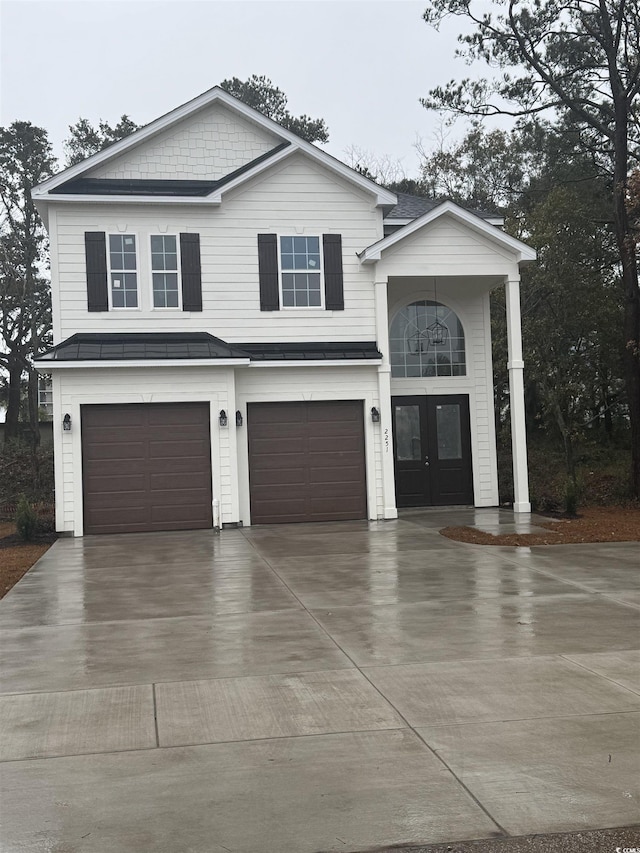 view of front of house featuring french doors and a garage