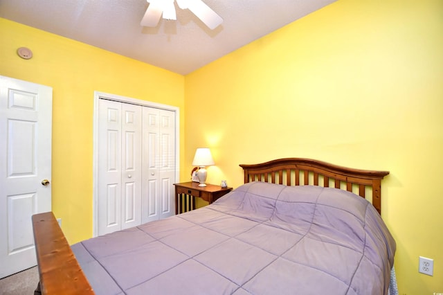 bedroom featuring ceiling fan and a closet