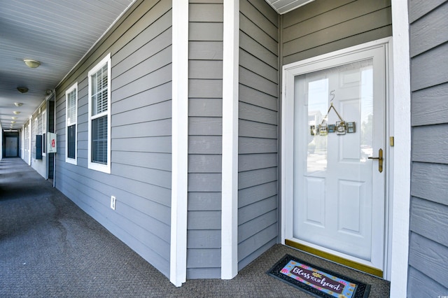 property entrance featuring covered porch