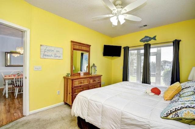 bedroom featuring ceiling fan and light colored carpet