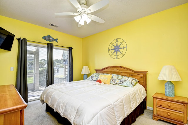 carpeted bedroom with ceiling fan and access to outside