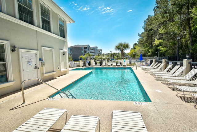 view of swimming pool featuring a patio