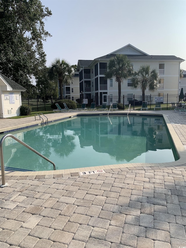 view of pool featuring a patio area