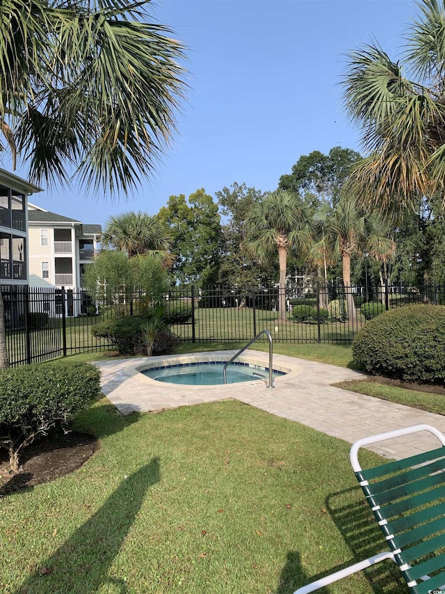 view of pool featuring a yard