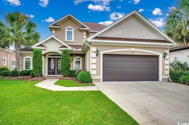 view of front of house featuring a front lawn and a garage