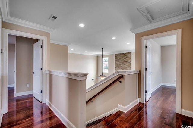 hallway with ornamental molding and dark wood-type flooring