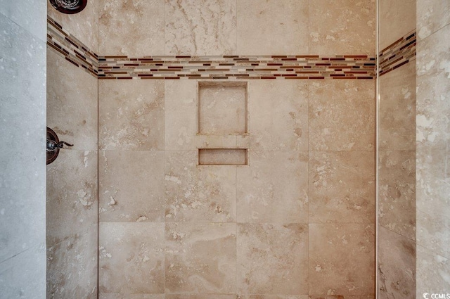 details with a tile shower