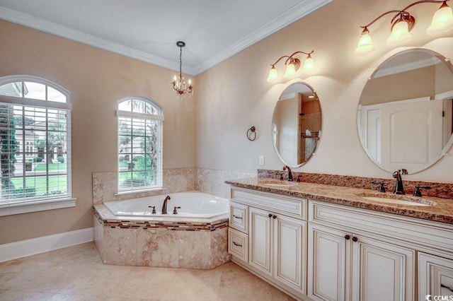 bathroom featuring tiled tub, crown molding, vanity, and a healthy amount of sunlight