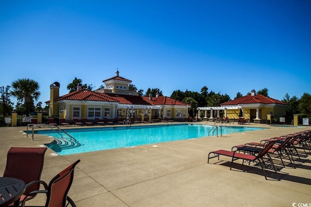 view of swimming pool featuring a patio