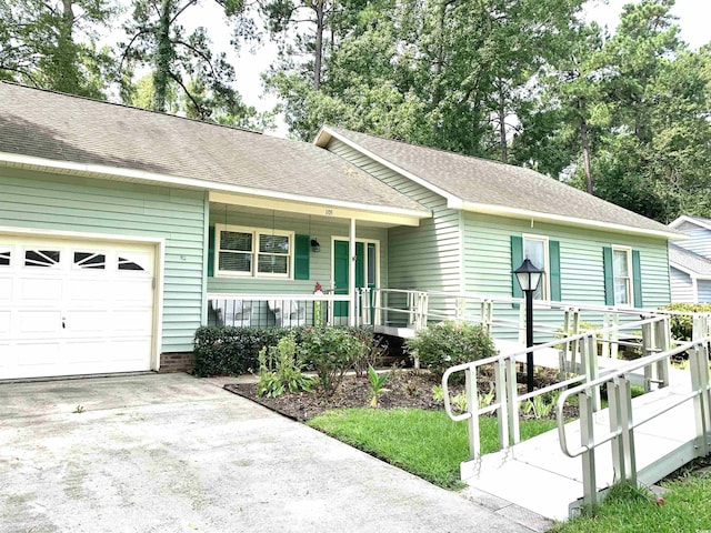 ranch-style house with a porch and a garage