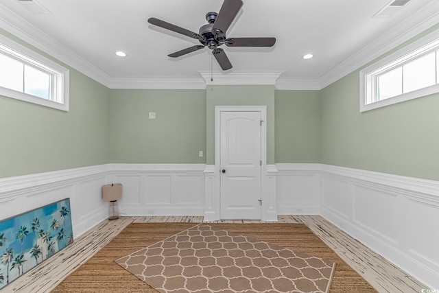 unfurnished room with crown molding, ceiling fan, and light hardwood / wood-style floors