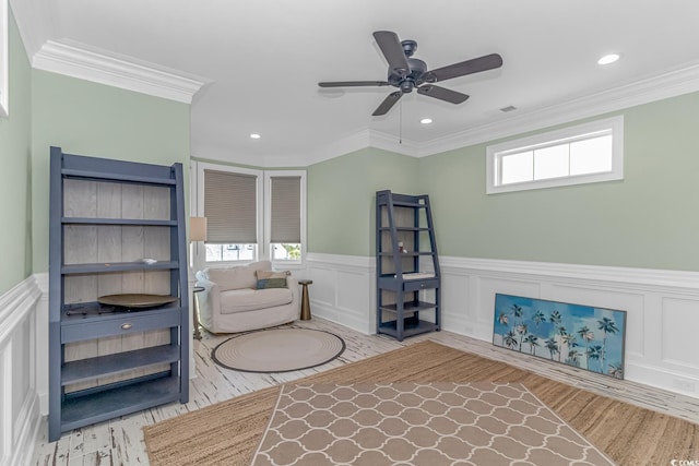 unfurnished living room with crown molding, wood-type flooring, and ceiling fan