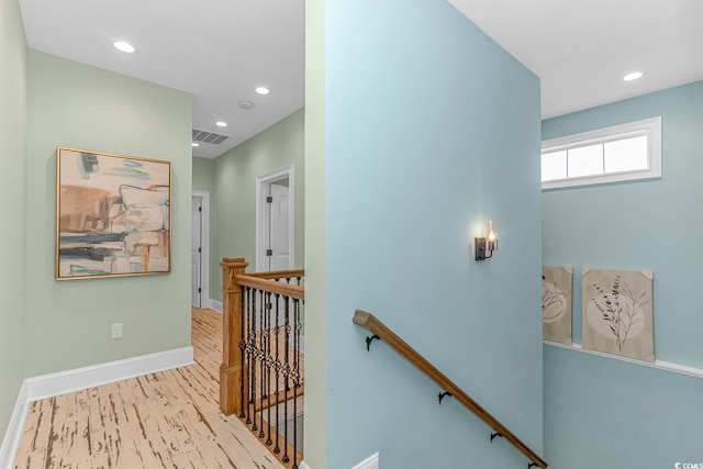 stairs featuring wood-type flooring