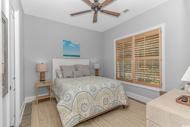 bedroom featuring ceiling fan and light hardwood / wood-style flooring