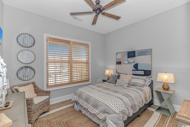 bedroom featuring hardwood / wood-style floors and ceiling fan