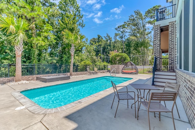 view of pool with a patio